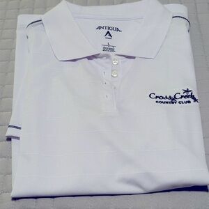 Antigua woman's bright white polo from Cross Creek in Ft Meyers FL